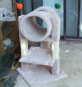 Cat tree with tube and two toys with springs at top