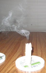[blown-out candle showing smoke]