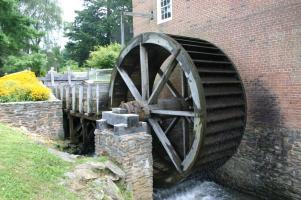 Water Wheel attached to brick building