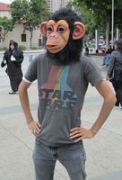 Man in chimp mask and star wars t-shirt