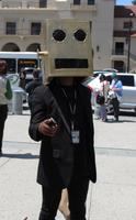 Man with cardboard robot head