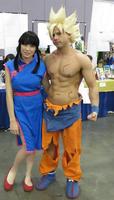 Warrior in orange pants with lady in blue Chinese-style dress