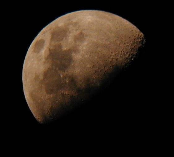 Sepia-toned three-quarters moon