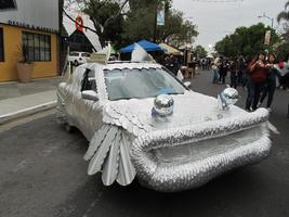 Car in a fish motif with silver scales and two rotating “disco balls” as eyes
