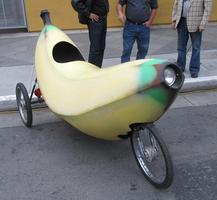 Three-wheeled bicycle on a shell shaped like a banana