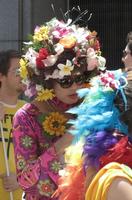 Woman in flowered dress and headdress made of flowers